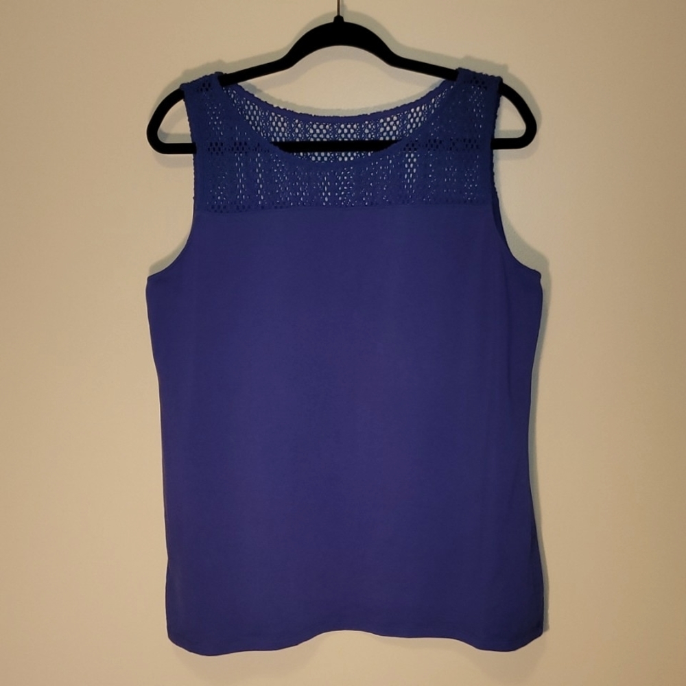 Sleeveless blue top with a pretty knit neckline.